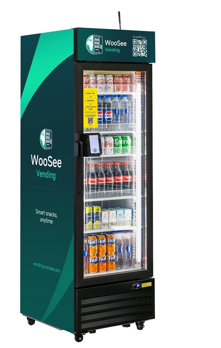 Sidobox smart fridge — branded glass-door cabinet with international snacks and drinks, on-door contactless terminal and QR code